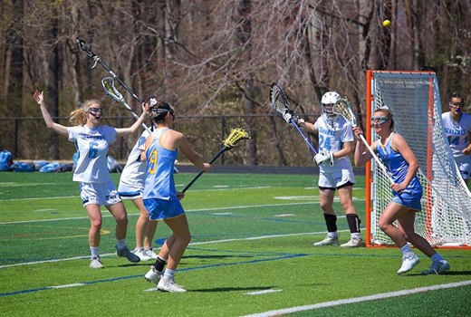 Lola Messick passes inside to Ella Rishko during the game at South River. TERRY PLOWMAN PHOTO